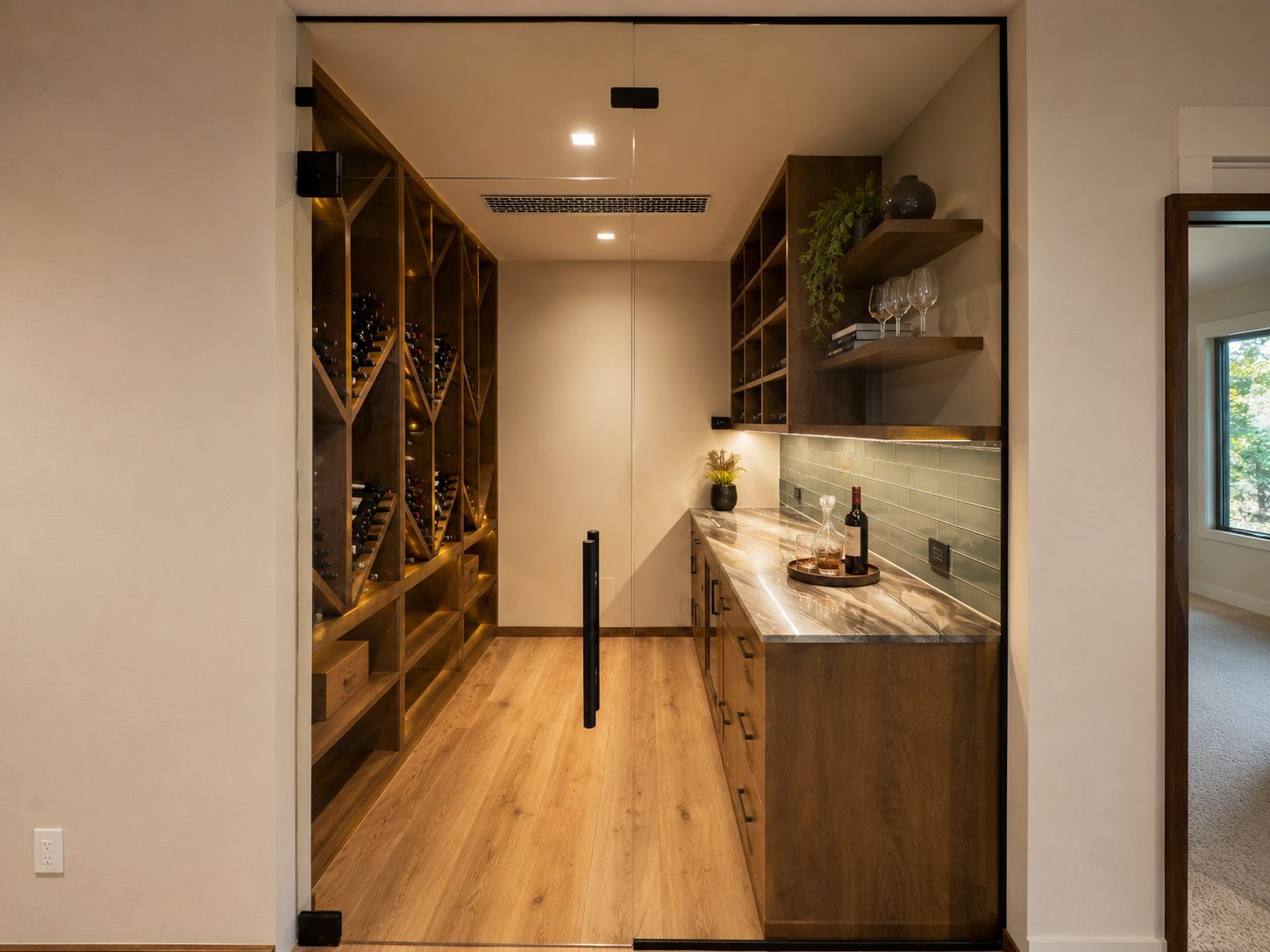 Glass-enclosed walk-in wine room with custom stained wood racking and tasting counter, Bend Oregon